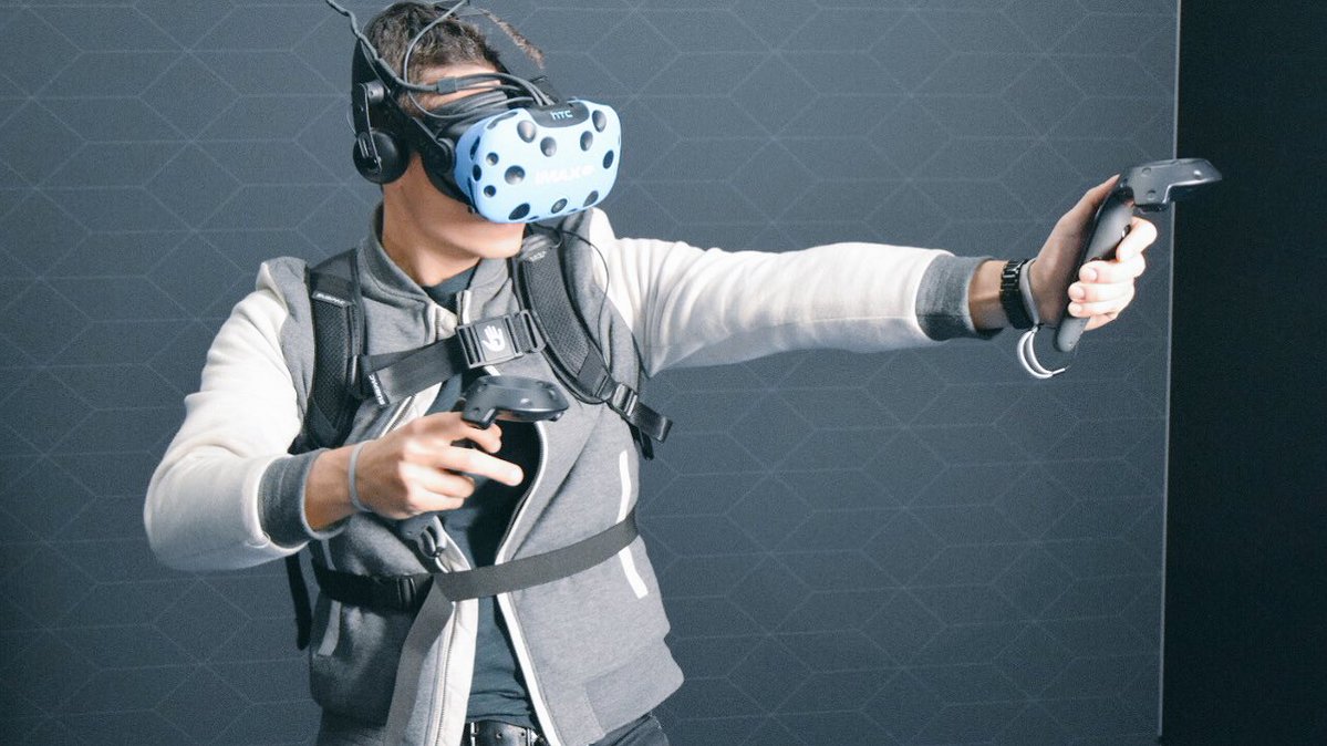 Photo of man playing virtual reality